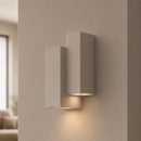 Applique in gesso verniciabile bianca con forma moderna e luce bidirezionale per pareti minimal e contemporanee