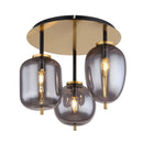 luce calda e riflessi dorati della plafoniera Blacky 3 luci
