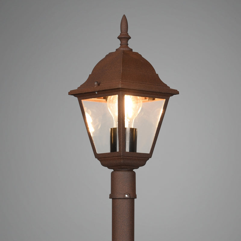 Palo per illuminazione rustica da giardino con finitura antichizzata e vetro.