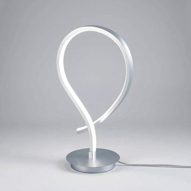 lampada da tavolo kiley design minimale dalle linee curve per interni contemporanei