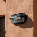 lampada per esterni ovale con palpebra in plastica nera IP44