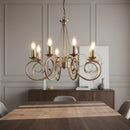 Lampadario ad 8 luci in metallo color ottone antico con struttura a bracci curvati dal gusto tradizionale