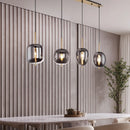 Lampadario con vetri fumé ideale sopra tavolo da pranzo isola cucina soggiorno e open space