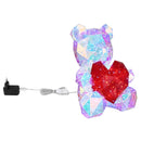 Orsetto luminoso LED con corpo sfaccettato trasparente e cuore rosso per cameretta o comodino