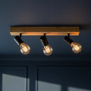 lampada a tre spot da parete o soffitto in legno chiaro e struttura in metallo nero
