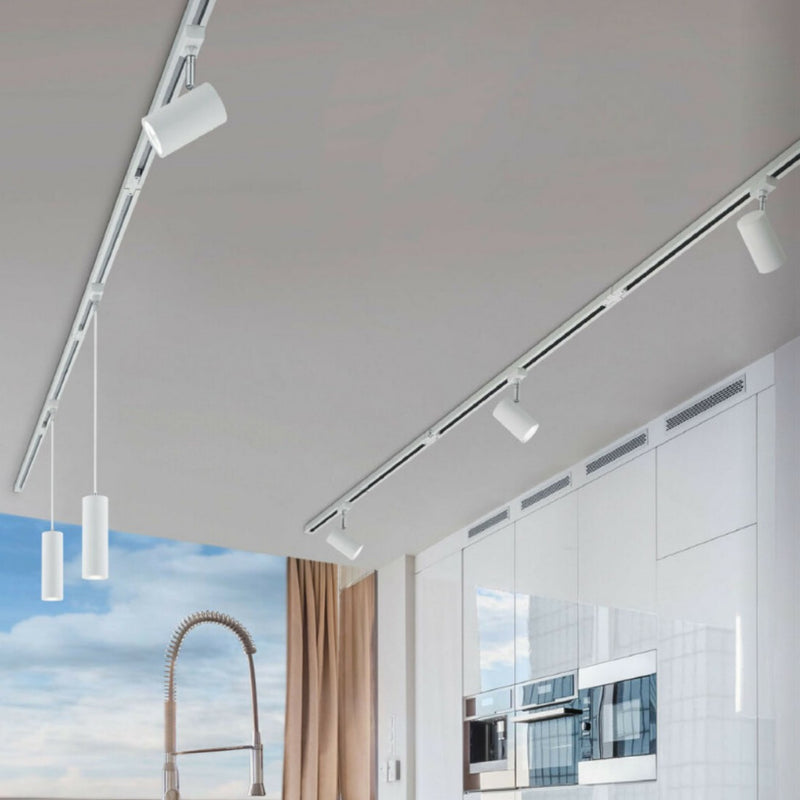 Sistema a binario LED bifase DUOline con binari neri e faretti orientabili, ideale per illuminare open space, showroom e cucine con isola