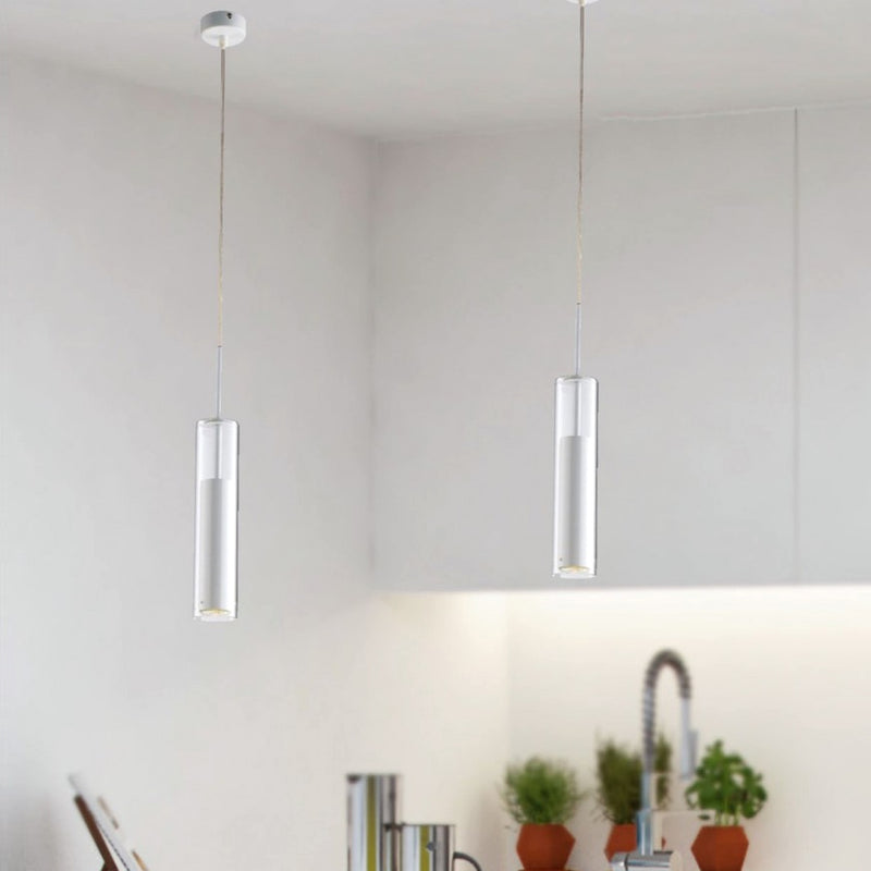 lampadario tubolare vetro trasparente ideale sopra tavolo studio e angolo lettura
